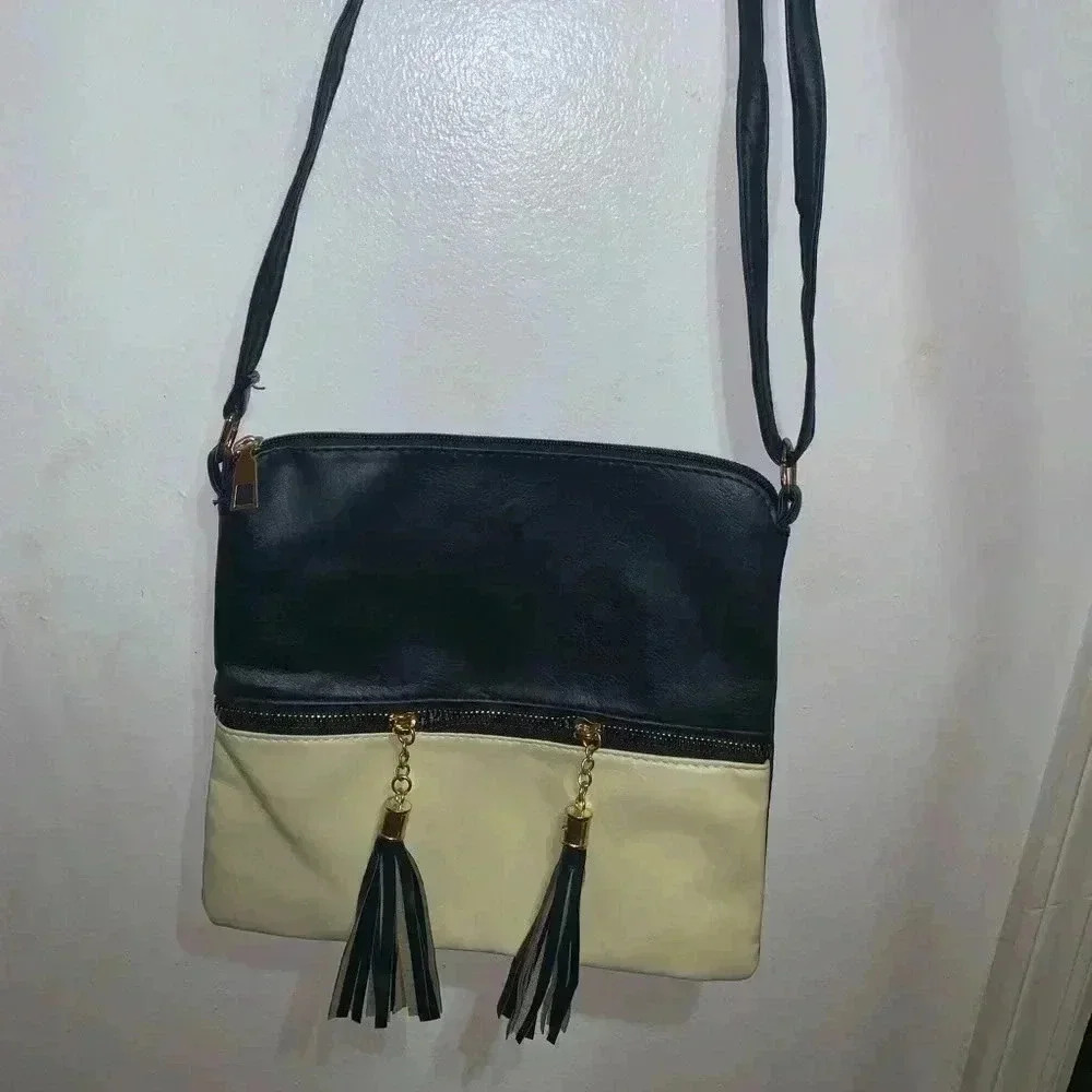 Cross body bag with tassels